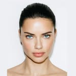 A photo of Adriana Lima, a Supermodel, who has a Soft Summer color profile.