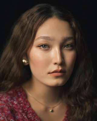 A photo of Aidana Sahari, a Actress, who has a Soft Autumn color profile.