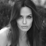 A photo of Angelina Jolie, a Actress, who has a Soft Autumn color profile.