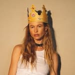 A photo of Behati Prinsloo, a Model, who has a Soft Autumn color profile.