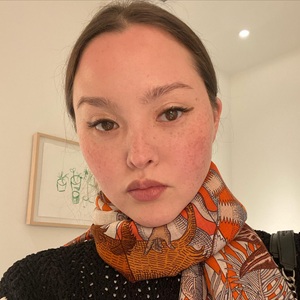 A photo of Devon Aoki, a Actress, who has a Soft Autumn color profile.