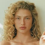 A photo of Dorit Revelis, a Model, who has a Soft Autumn color profile.