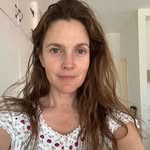 A photo of Drew Barrymore, a Actress, who has a Soft Autumn color profile.