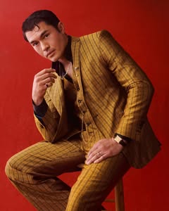 A photo of Henry Golding, a Actor, who has a Bright Winter color profile.