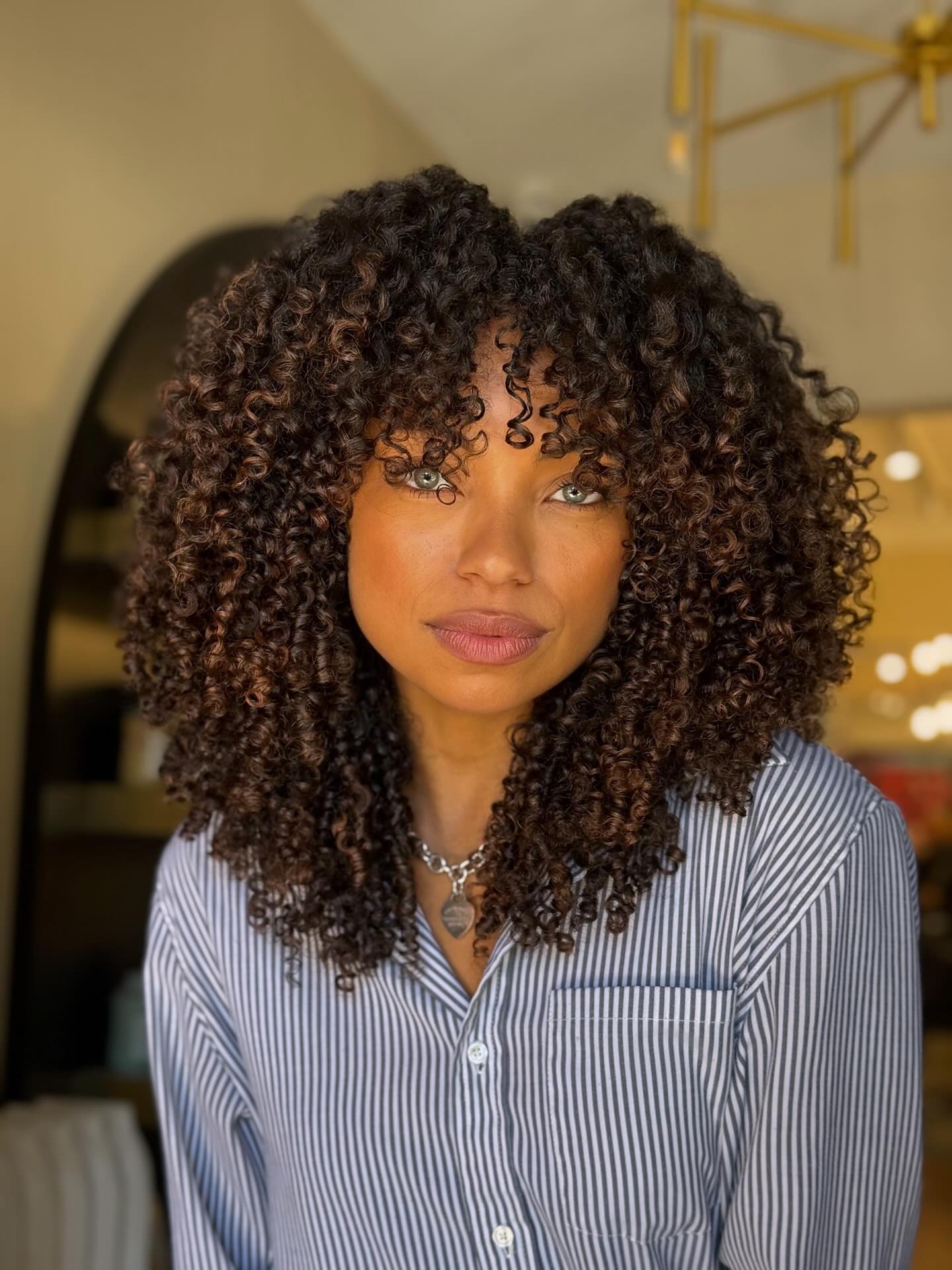 A photo of Logan Browning, a Actress, who has a Soft Autumn color profile.