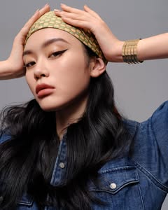 A photo of Ming Xi, a Model, who has a Bright Winter color profile.