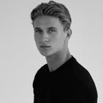 A photo of Thomas Kuc, a Actor, who has a Light Summer color profile.