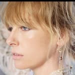A photo of Toni Collette, a Actress, who has a Soft Autumn color profile.
