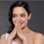 A photo of Archie Panjabi, a Actress, who has a Dark Winter color profile.