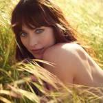 A photo of Dakota Johnson, a Actress, who has a Soft Summer color profile.