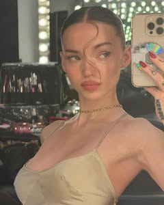A photo of Dove Cameron, a Actress, who has a Light Spring color profile.