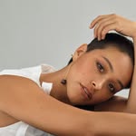 A photo of Gina Rodriguez, a Actress , who has a Bright Spring color profile.