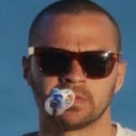 A photo of Jesse Williams, a Actor, who has a Soft Summer color profile.