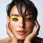A photo of Kat Graham, a Actress, Singer, who has a Dark Autumn color profile.