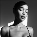 A photo of Laura Harrier, a Actress, Model, who has a Bright Winter color profile.