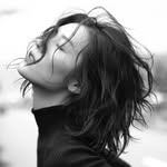A photo of Liu Wen, a Model, who has a Dark Winter color profile.