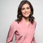 A photo of Lucy Verasamy, a Weather Presenter, who has a Dark Winter color profile.