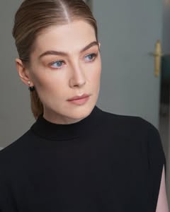 A photo of Rosamund Pike, a Actress, who has a Light Spring color profile.