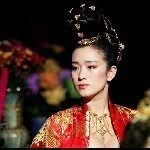 A photo of Gong Li, a Actress, who has a Dark Winter color profile.