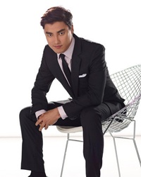 A photo of Remy Hii, a Actor, who has a Dark Winter color profile.