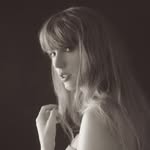 A photo of Taylor Swift, a Singer, Songwriter, who has a Light Spring color profile.